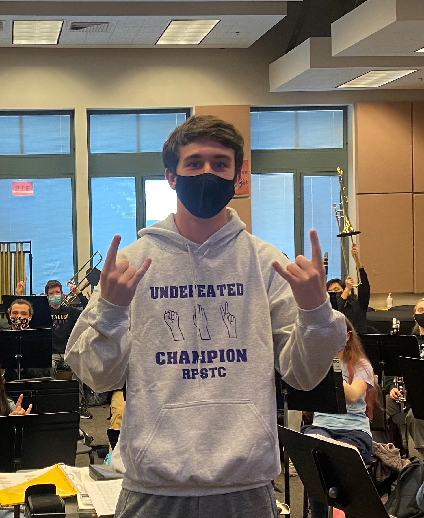 Photo - Champion with Sweatshirt rock paper scissors tournament prize
