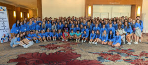 The Great Lakes region celebrates its 2024 Region of the Year award with a group photo at the Jostens Renaissance Global Conference this summer in Orlando, Fla.